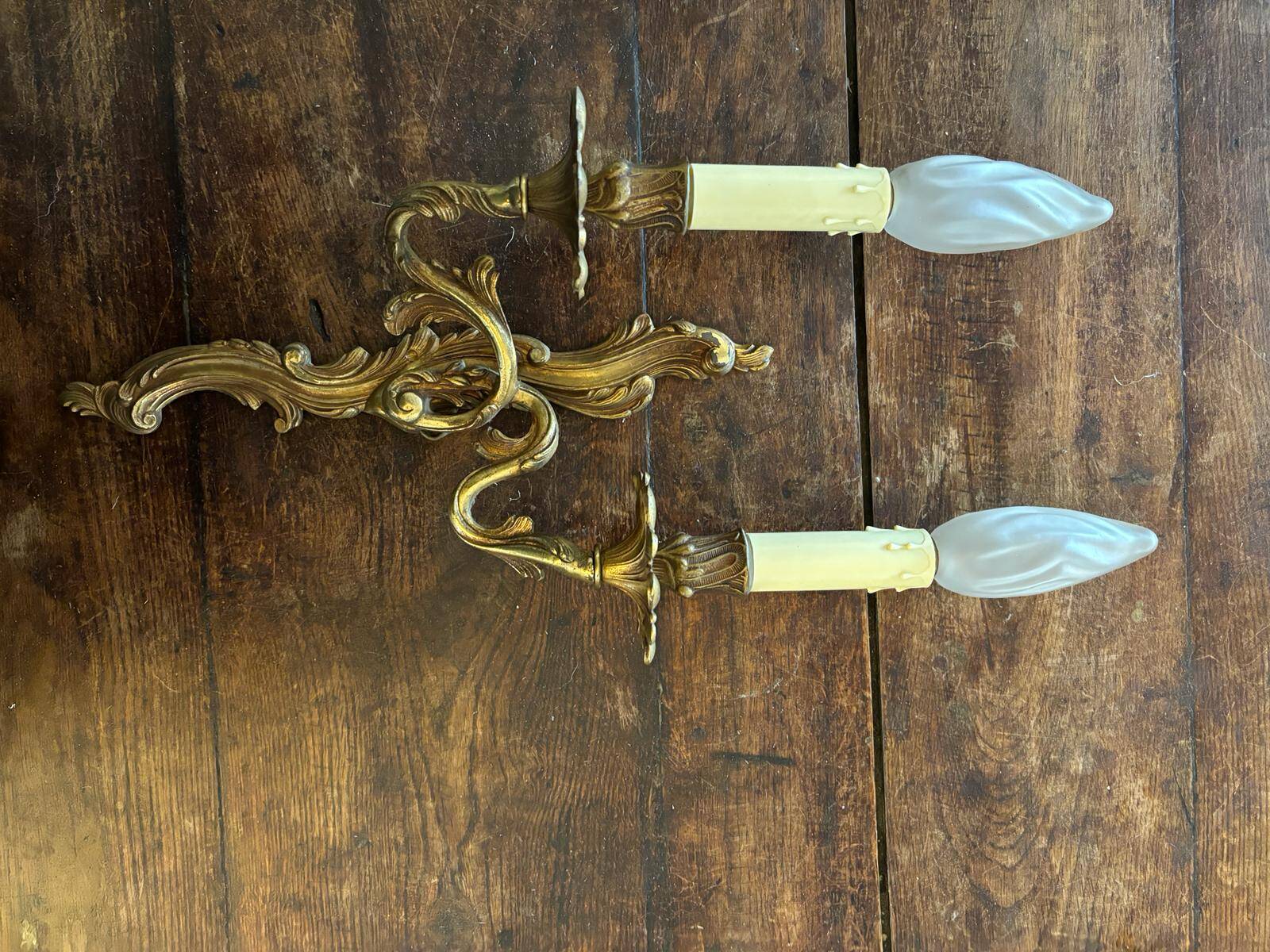 Pair of Louis XV Style wall lights in gilded bronze