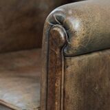 Vintage sheepskin armchair with warm colours and a characterful appearance