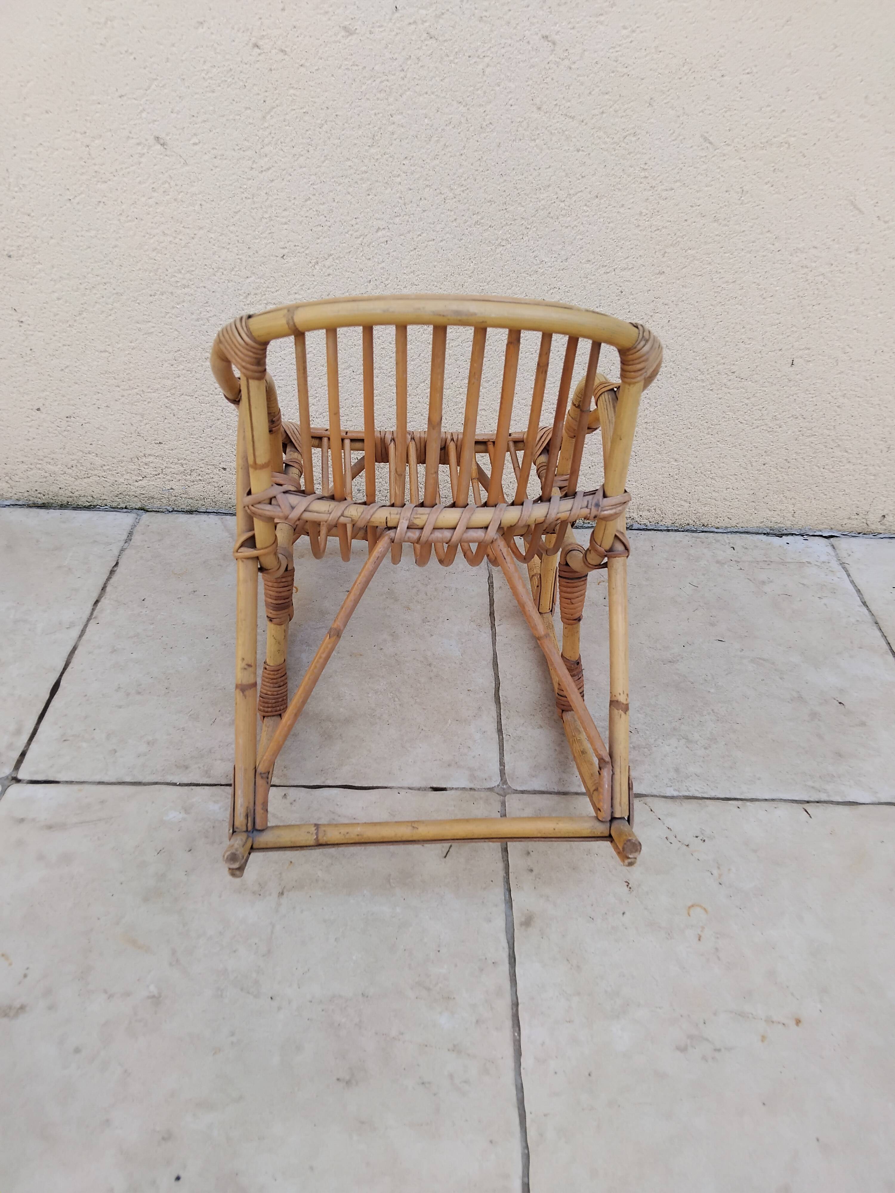 Vintage children's rattan rocking chair