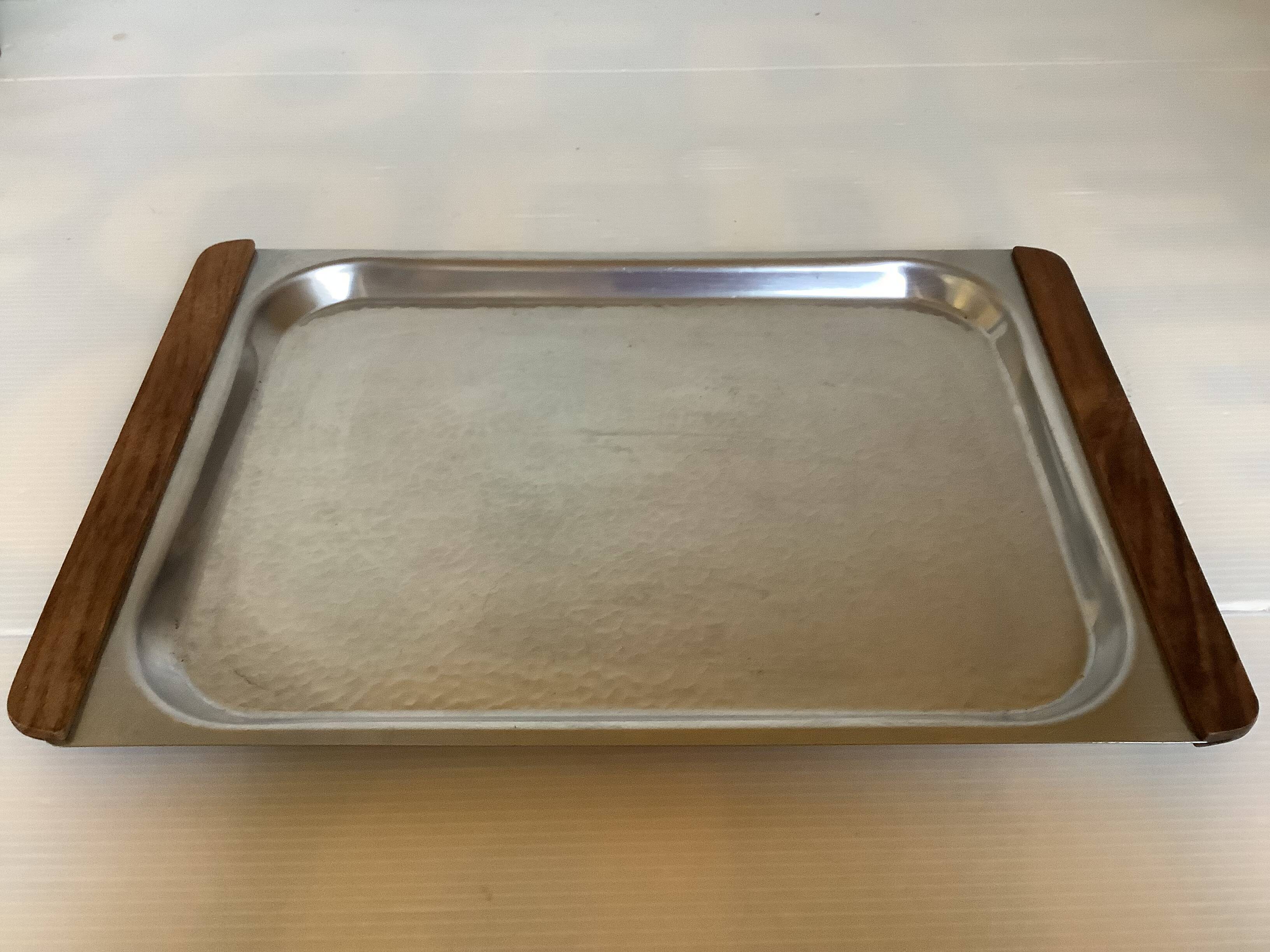 Small hammered metal and wood tray in Scandinavian style.