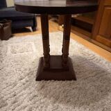 1930s Art Deco round side table in brown wood — circular top and turned legs.