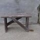 Low stool in vintage brown painted pine from the 1940s, with a rectangular seat.