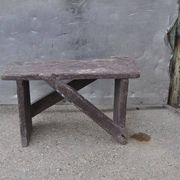 Low stool in vintage brown painted pine from the 1940s, with a rectangular seat.