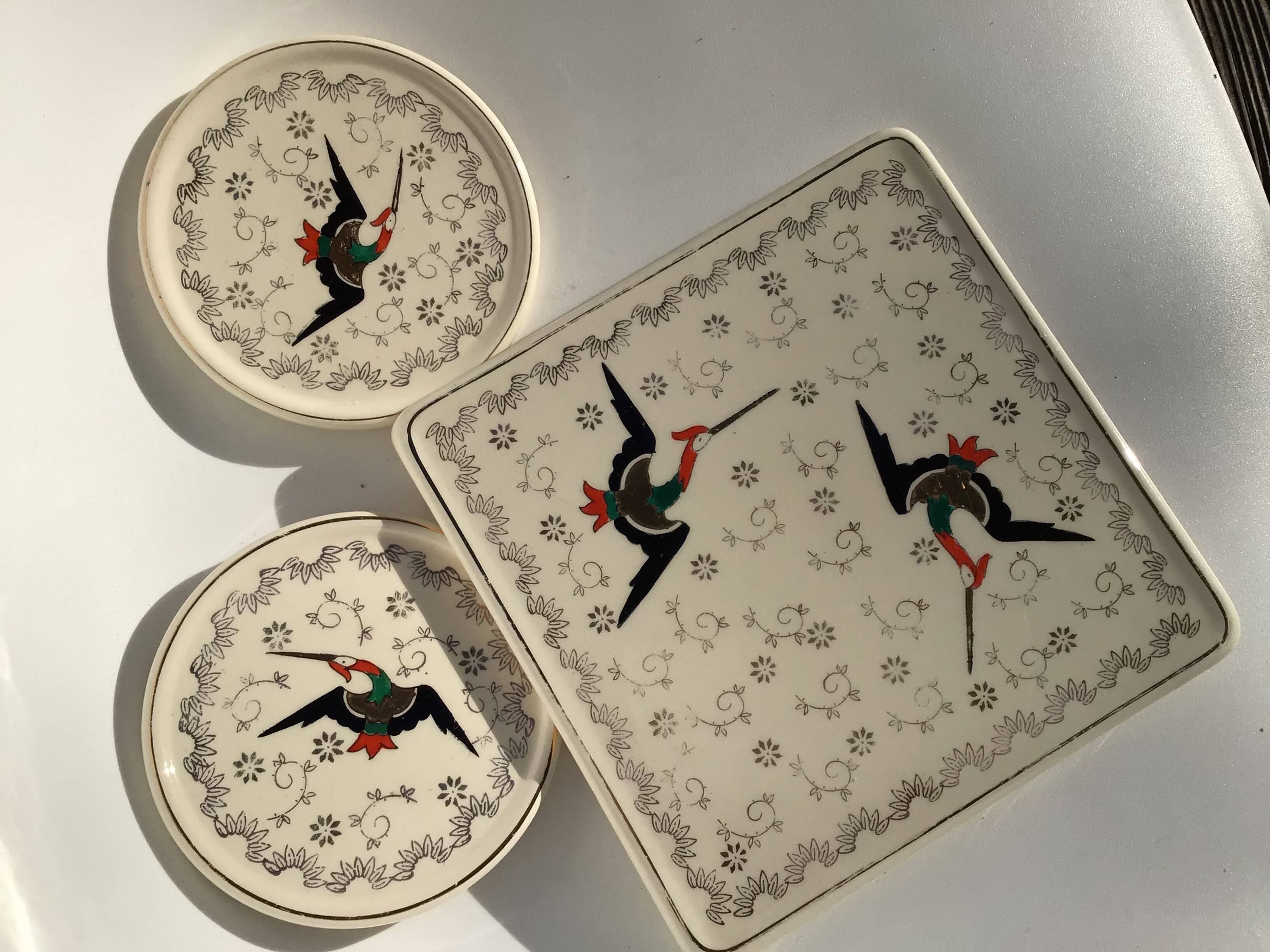 Longwy Chypre cream trivets and bottles