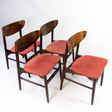 Set of four dining room chairs in rosewood and upholstered with red fabric, of danish design, 1960s