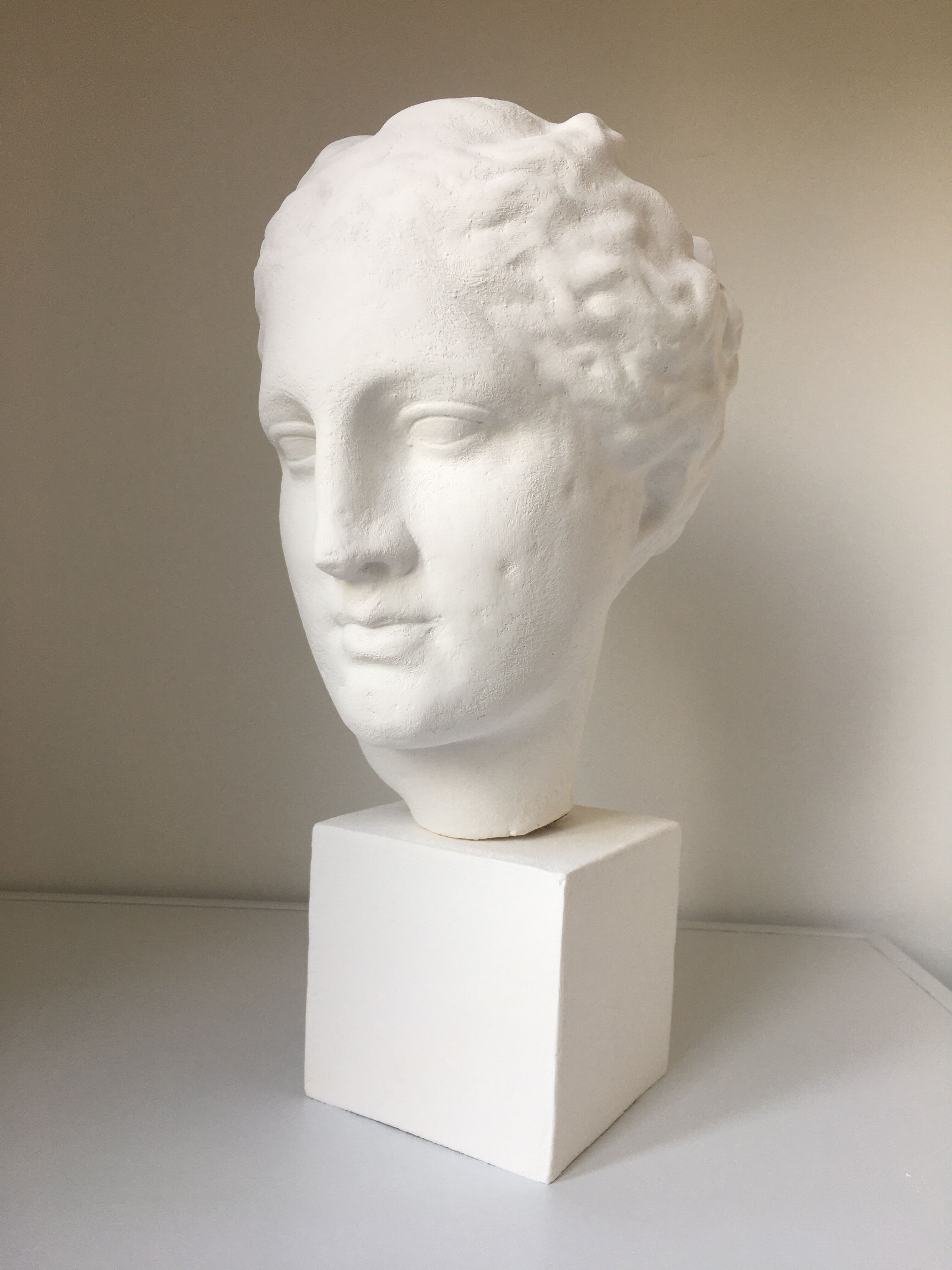 Greek Ap Hygie head. Scopas Hellenistic Greek art in plaster-bleached terracotta