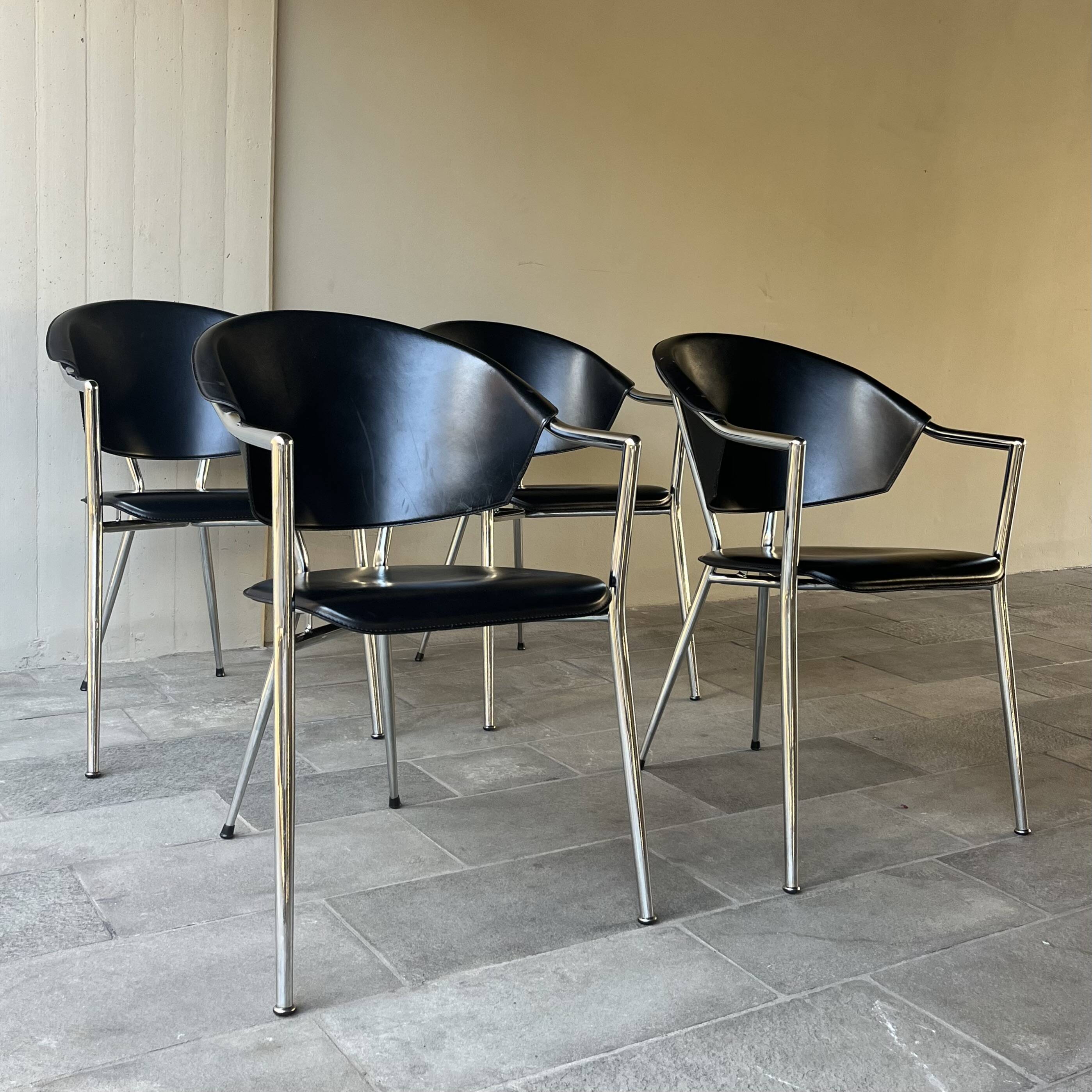 Set of four Italian black leather chairs, 1970