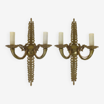 Pair of two-armed Empire wall sconces in gilded bronze