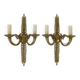 Pair of two-armed Empire wall sconces in gilded bronze