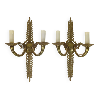 Pair of two-armed Empire wall sconces in gilded bronze