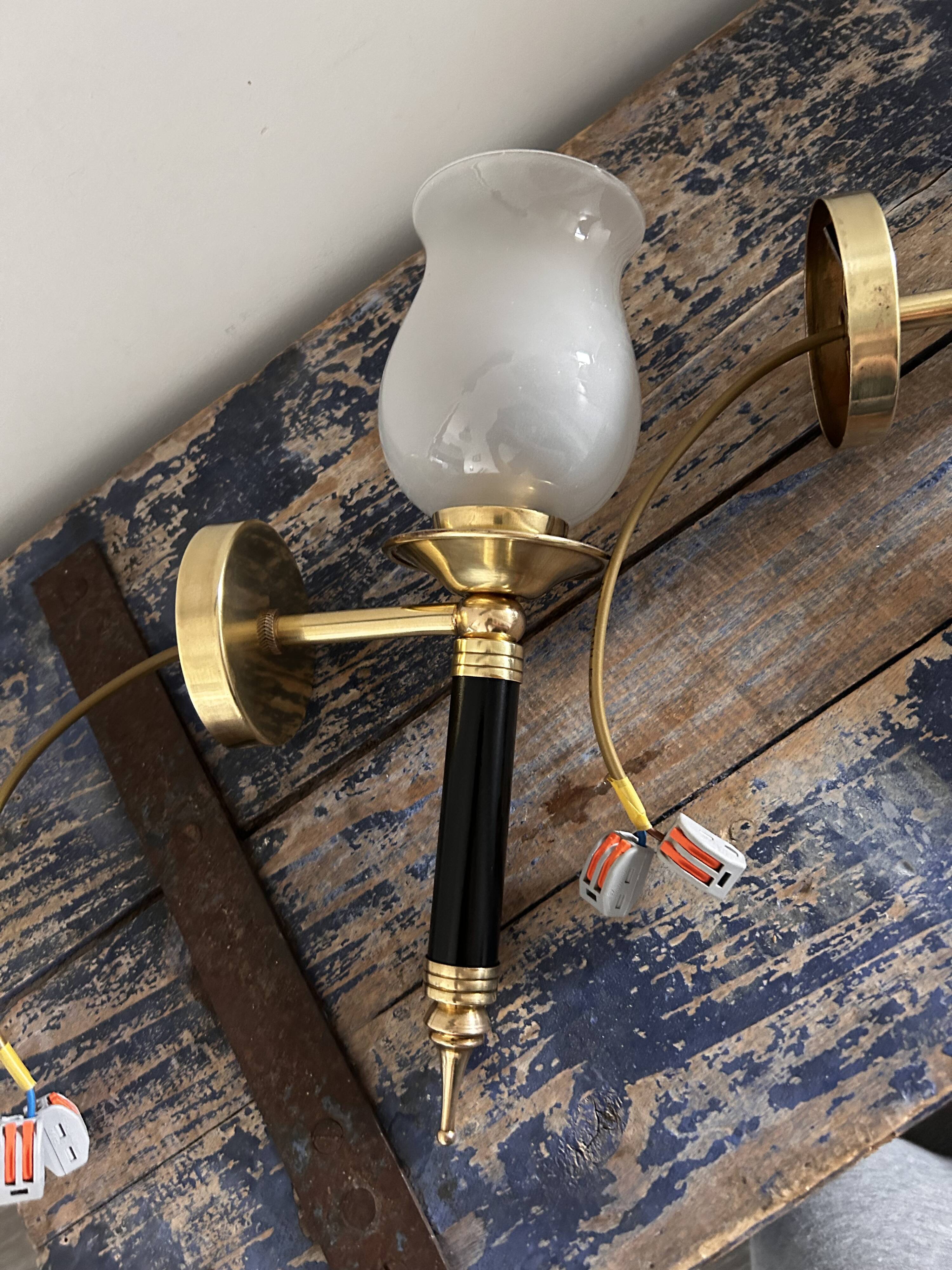 Pair of brass and black torchiere wall lights