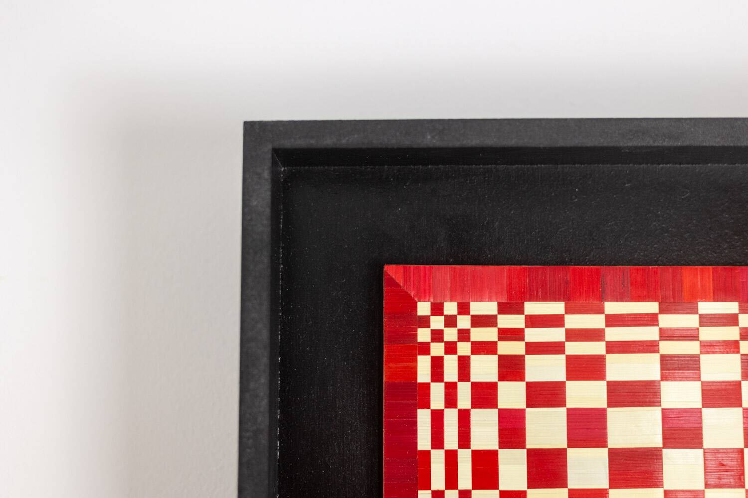 Pair of panels in red and gold straw marquetry. Contemporary.