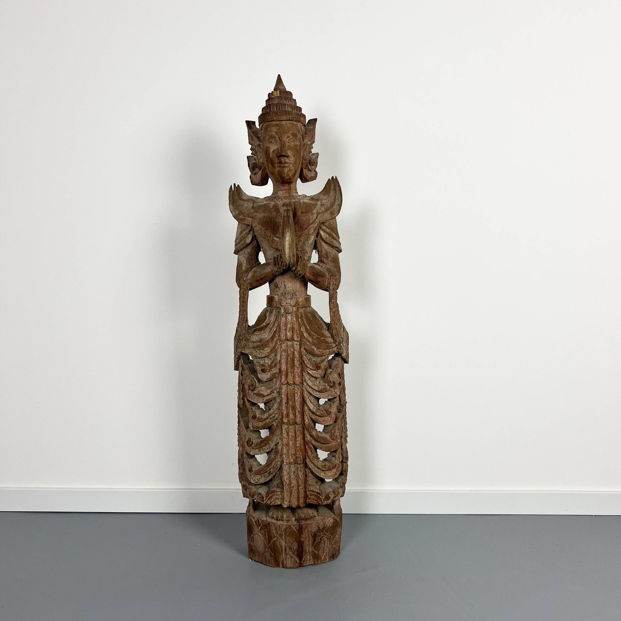 Large carved wooden statuette of a kinaree worshipping a devi. Thailand