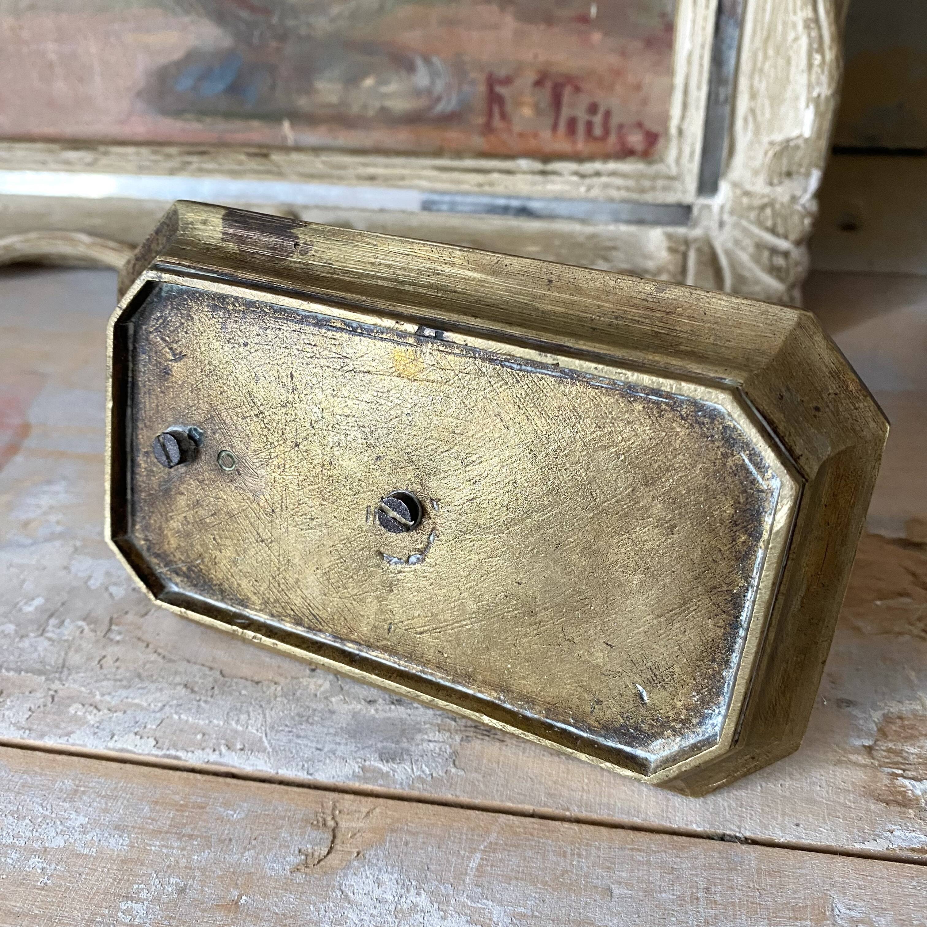 Antique brass thumb candle holder