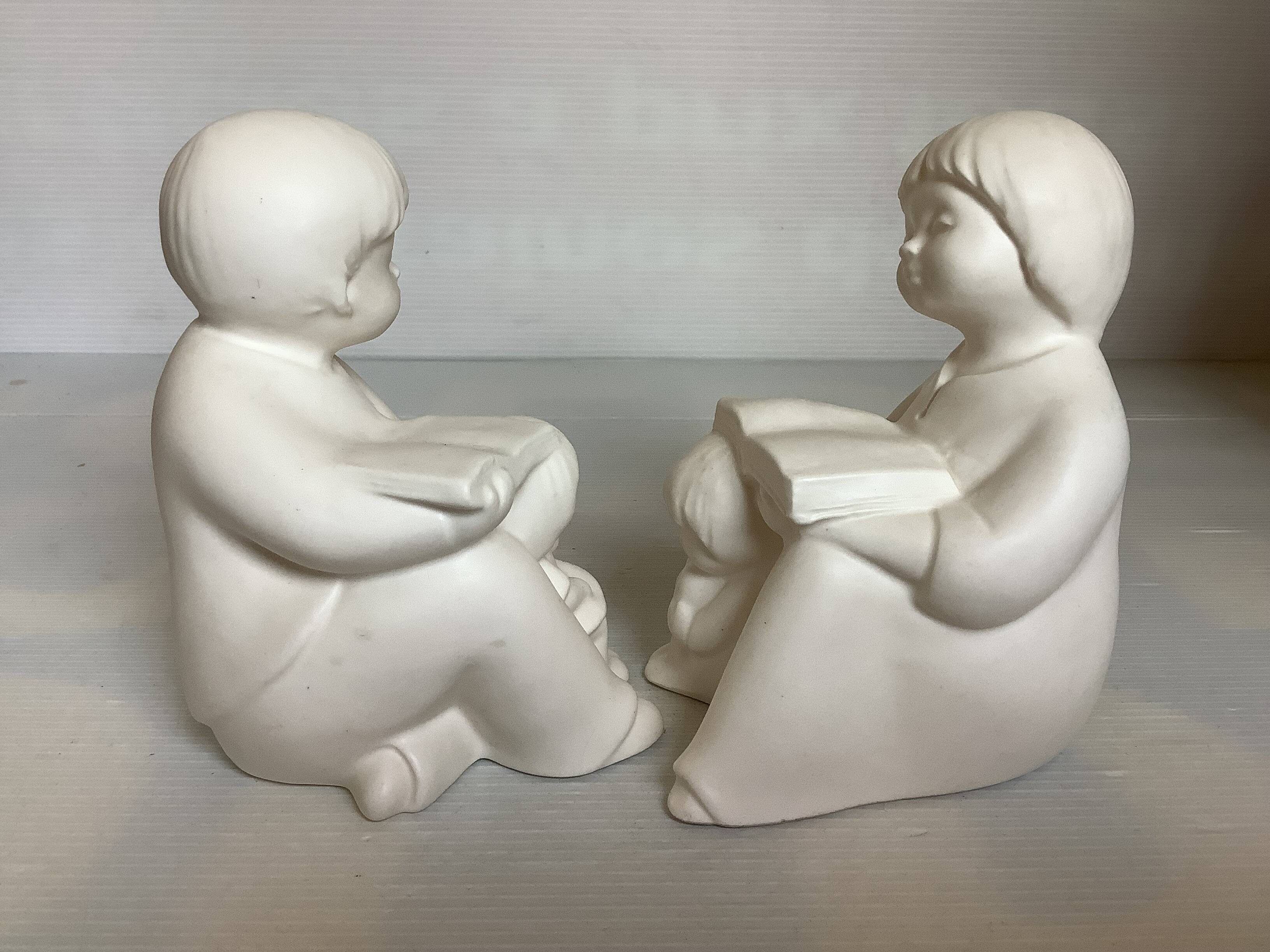 Pair of bookends with a matte white glaze for children.