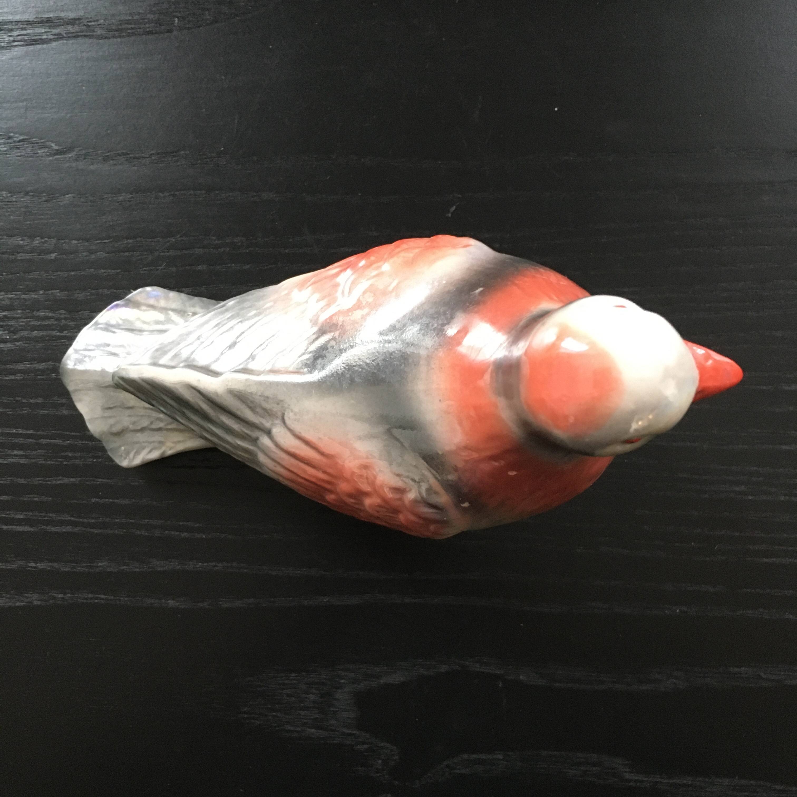 Antique bird in pearly ceramic