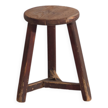 Old round stool in dark colour (c.1920)