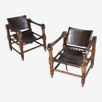 Pairs of vintage Safari style armchairs in wood and leather