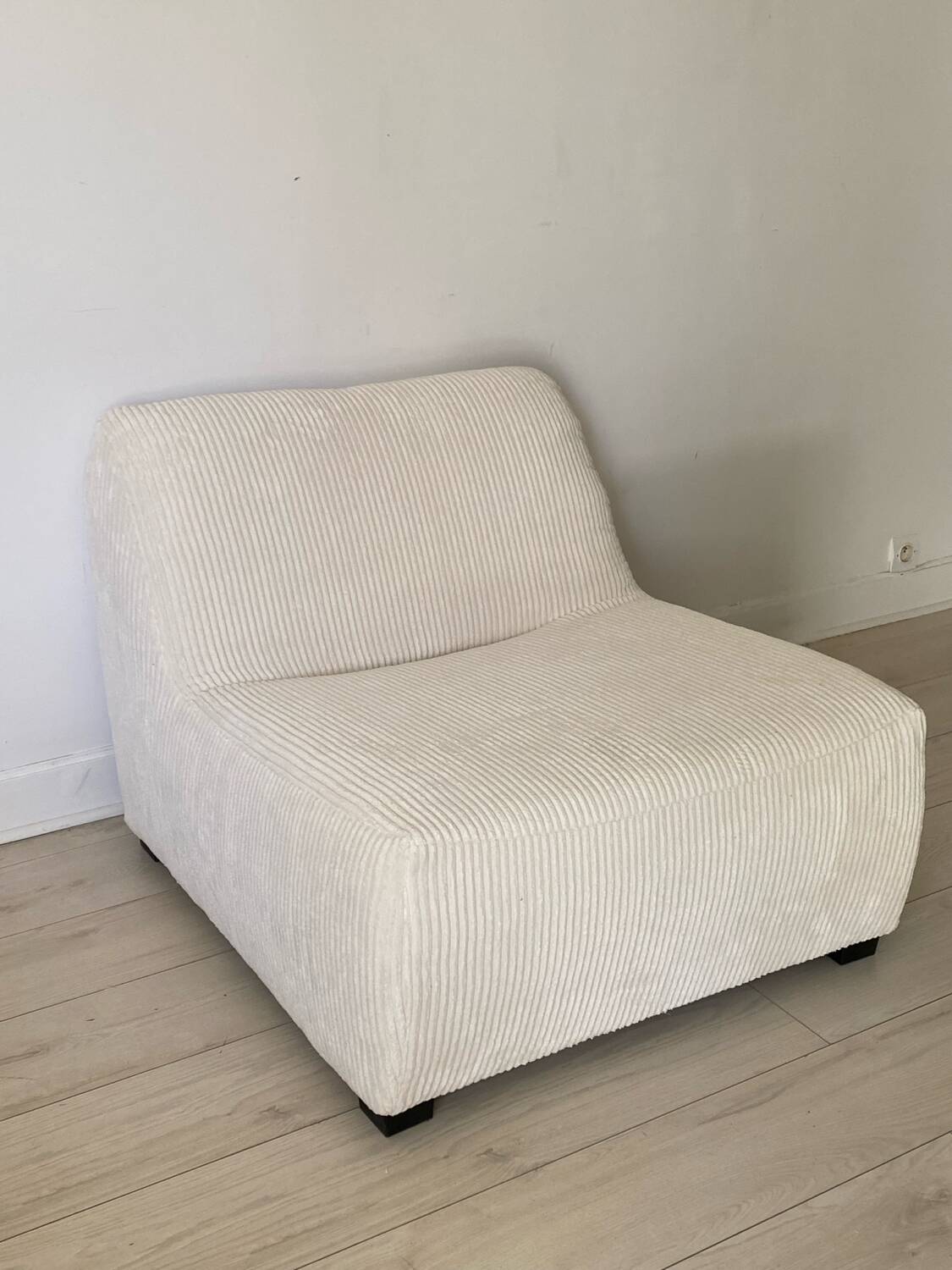 White corduroy armchair