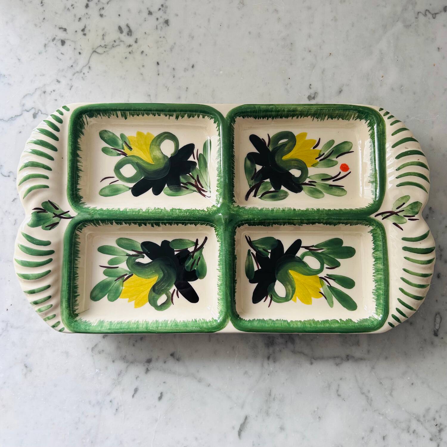 Serving dish with floral decoration signed
