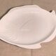 Serving dish in the shape of a white glazed ceramic fish