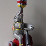 Vintage mechanical toys 'JW /Germany Western' 'Elephant on scooter'