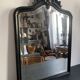 Miroir Napoléon III en bois noir à fronton