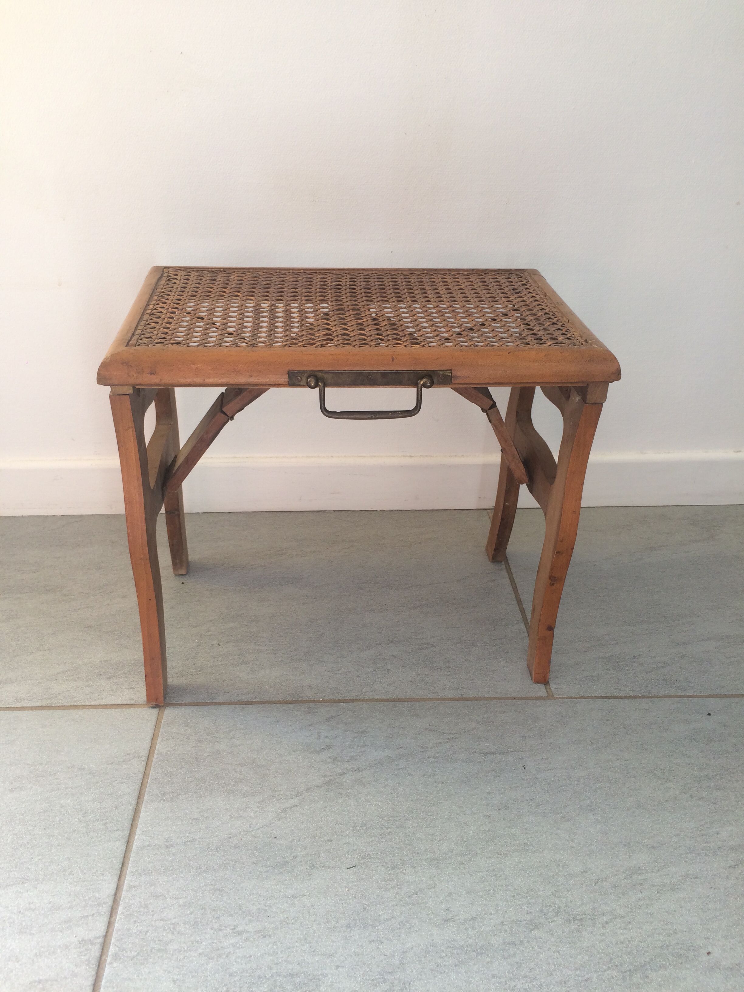 Folding stool in old caning