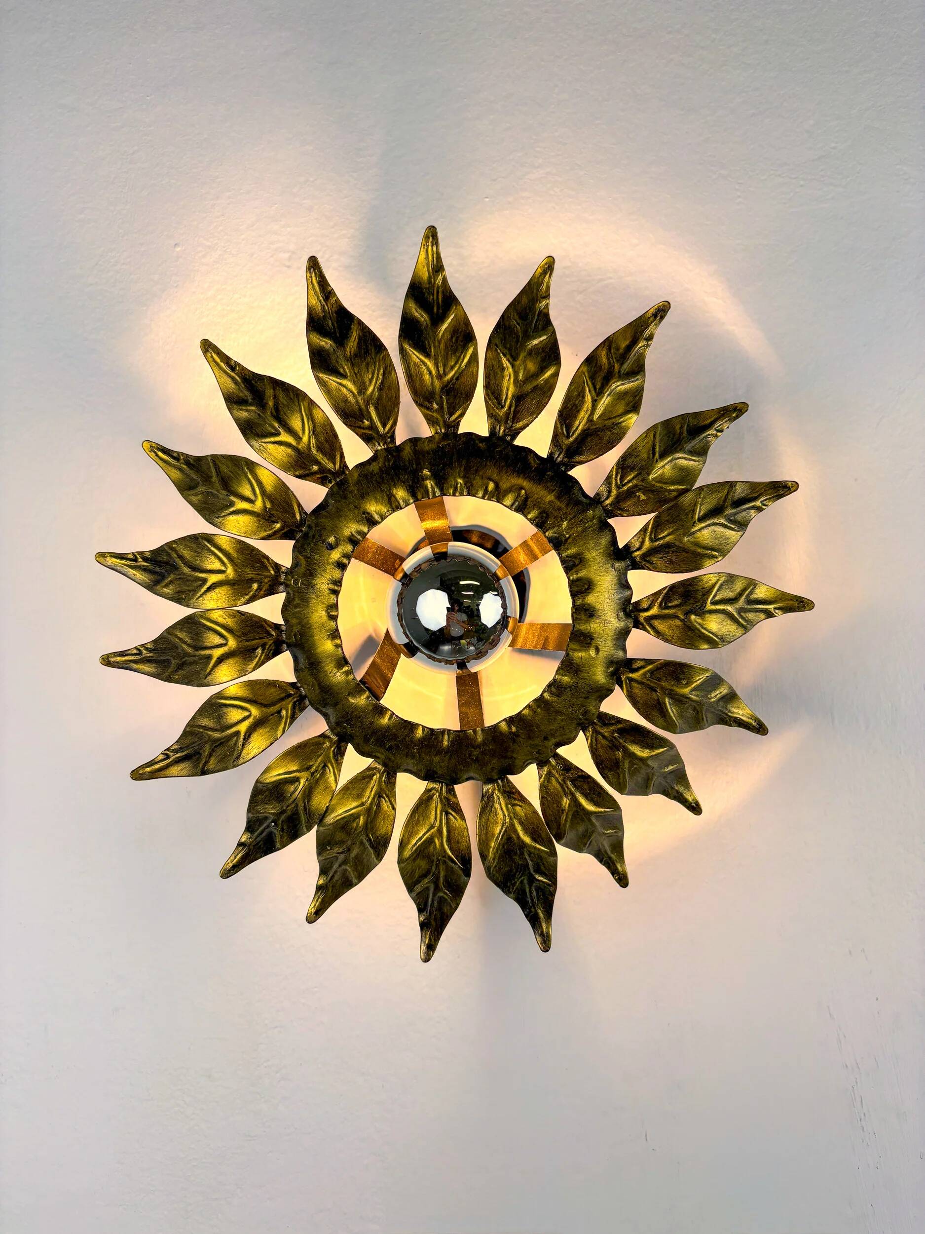 Sunburst ceiling light fixture or sconce in gilt wrought iron, Spain, circa 1960s