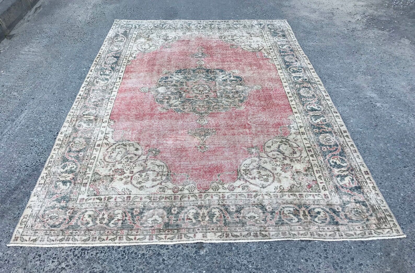 Pale pink rug with medallion