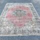 Tapis rose pâle avec médaillon