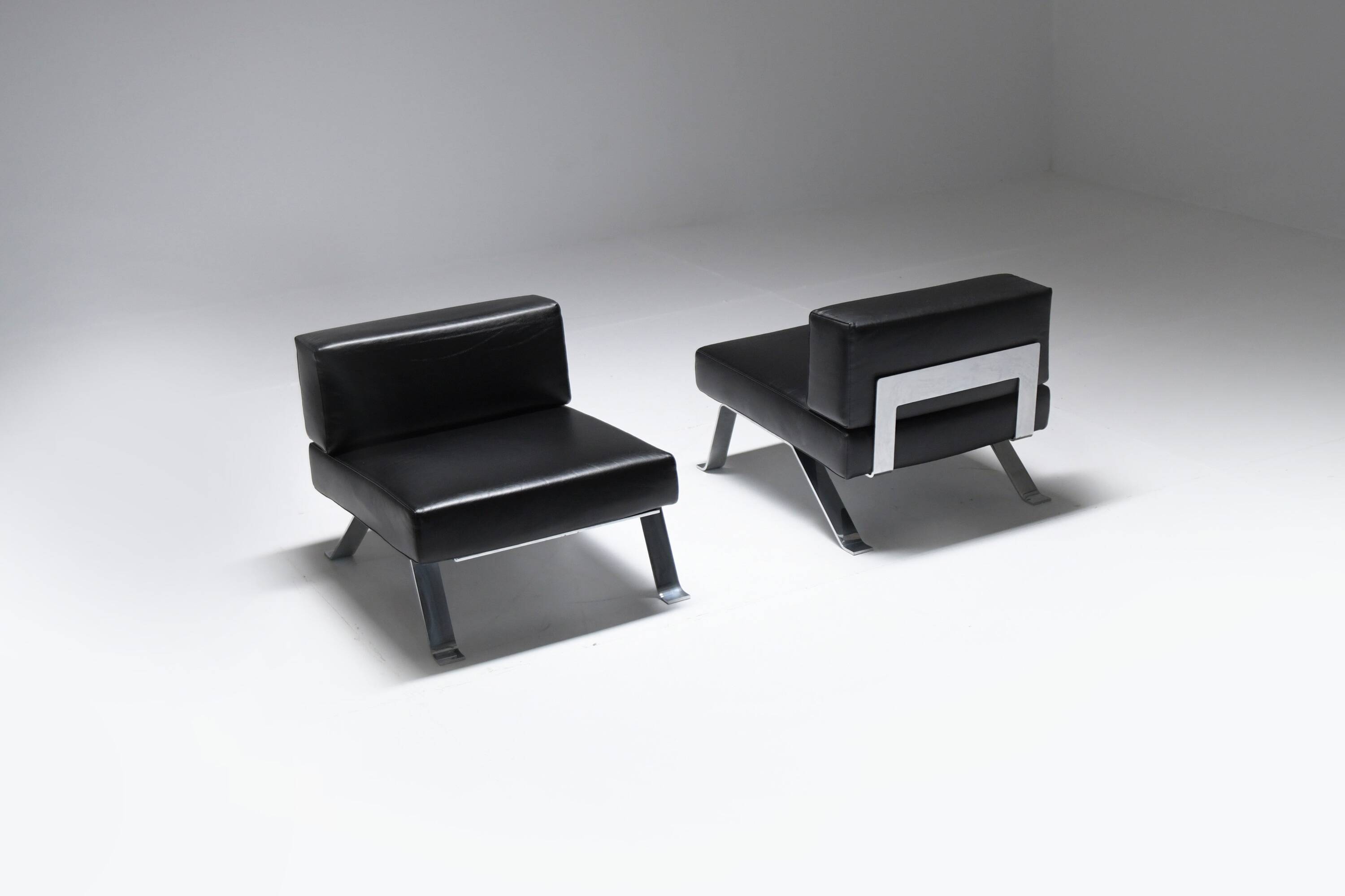 Black leather Ombra 512 lounge chairs by Charlotte Perriand for Cassina Italy
