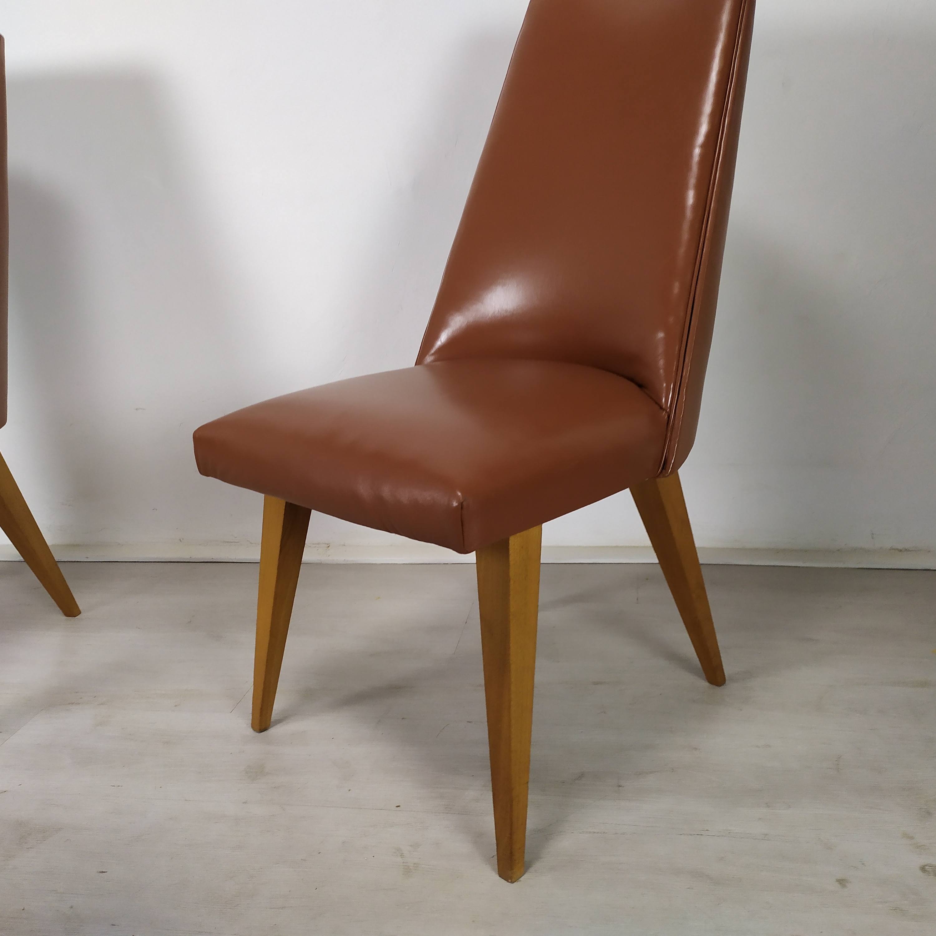 8 brown skai chairs 1950