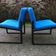 Electric blue fabric designer armchairs with black lacquered metal legs from the 80s.