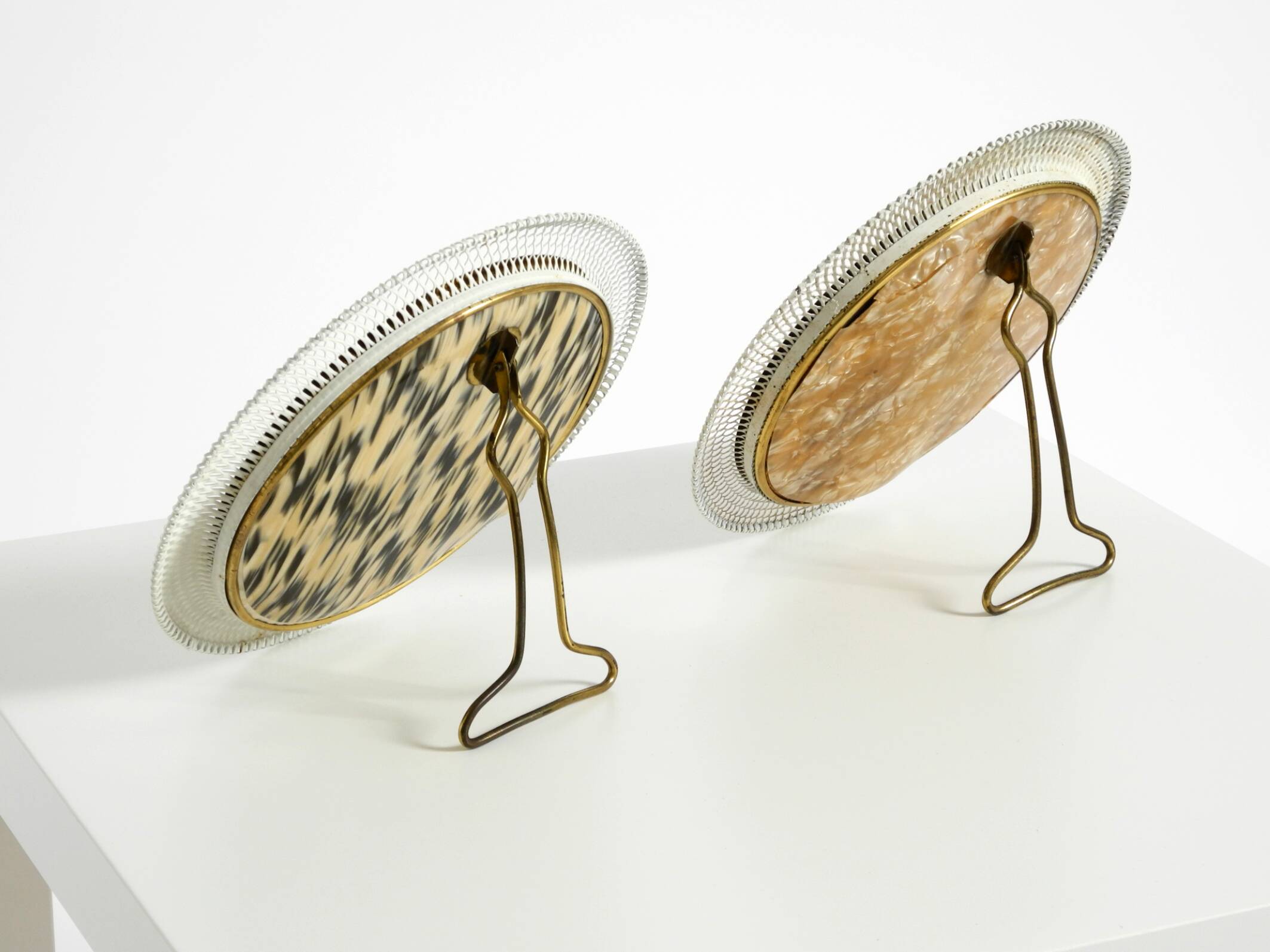 Pair of rare small Mid Century Modern table mirrors with expanded metal fra