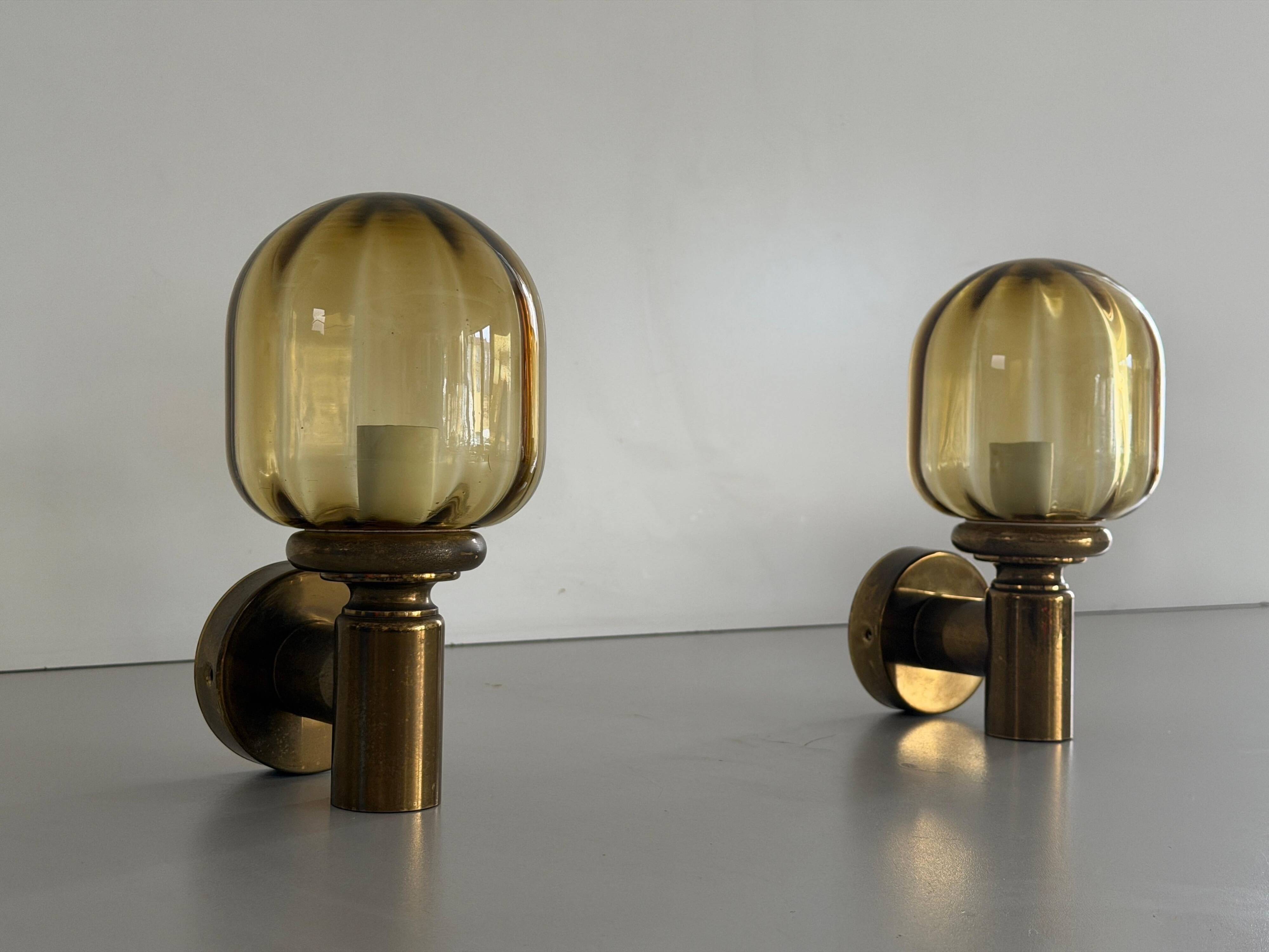Pair of yellow glass and brass wall lights from the mid-century by N Leuchten, 1960s, Germany.