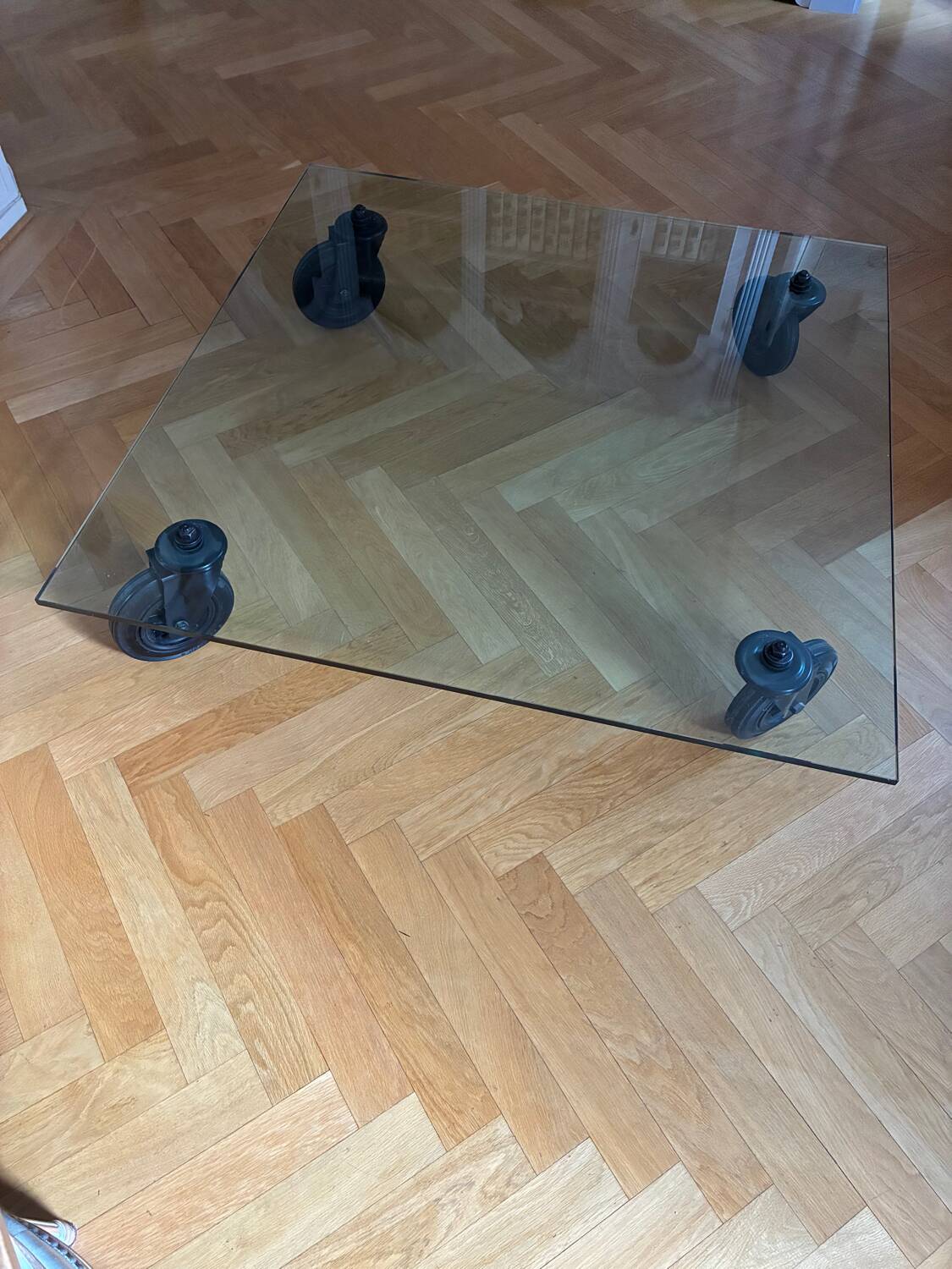 Four-wheeled tables by Gae Aulenti for Fontana Arte