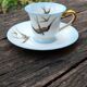 Tasse et sa soucoupe en porcelaine de Limoges motif "hirondelles"