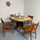 Round table in solid wood, thick top, vintage brutalist style from the 1960s.