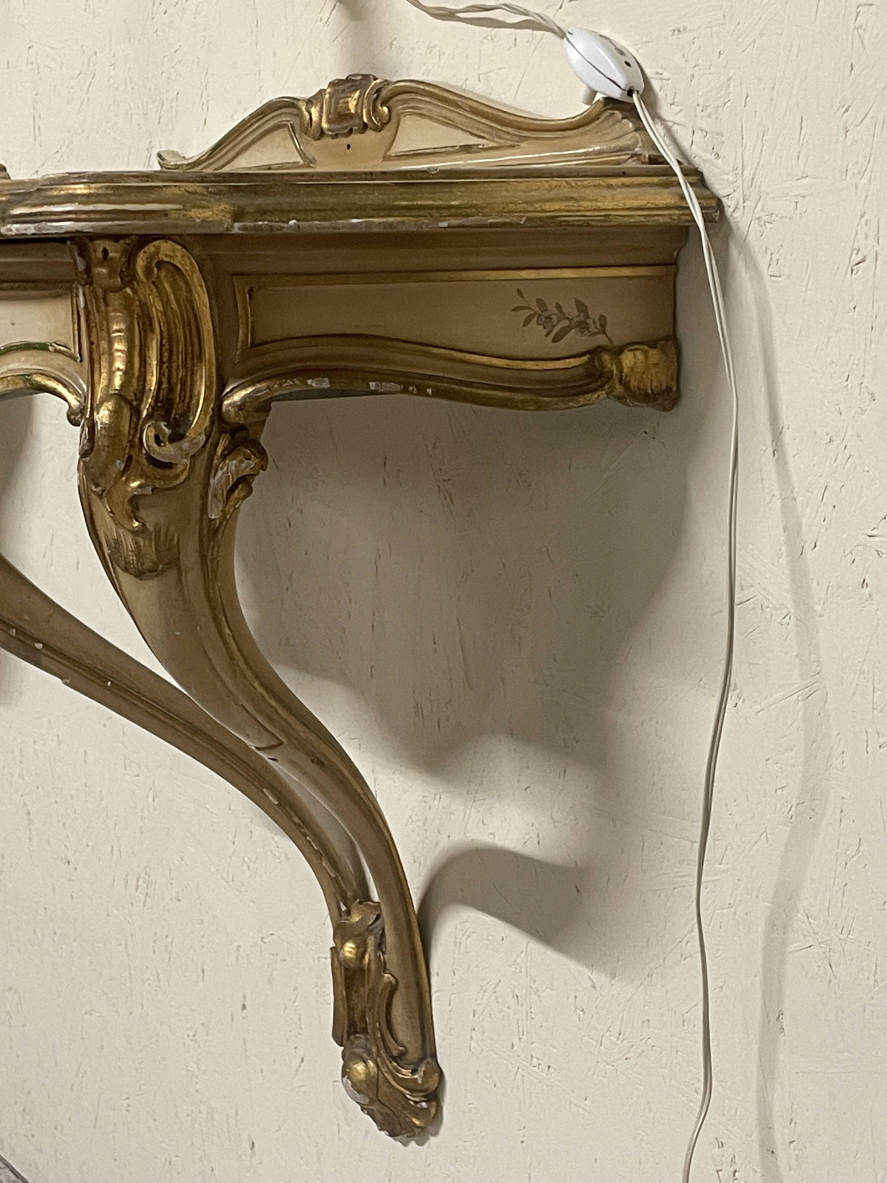Pair of wall-mounted consoles with a mirror in Louis XV style.