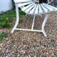 Old garden bench with metal legs and wooden slats