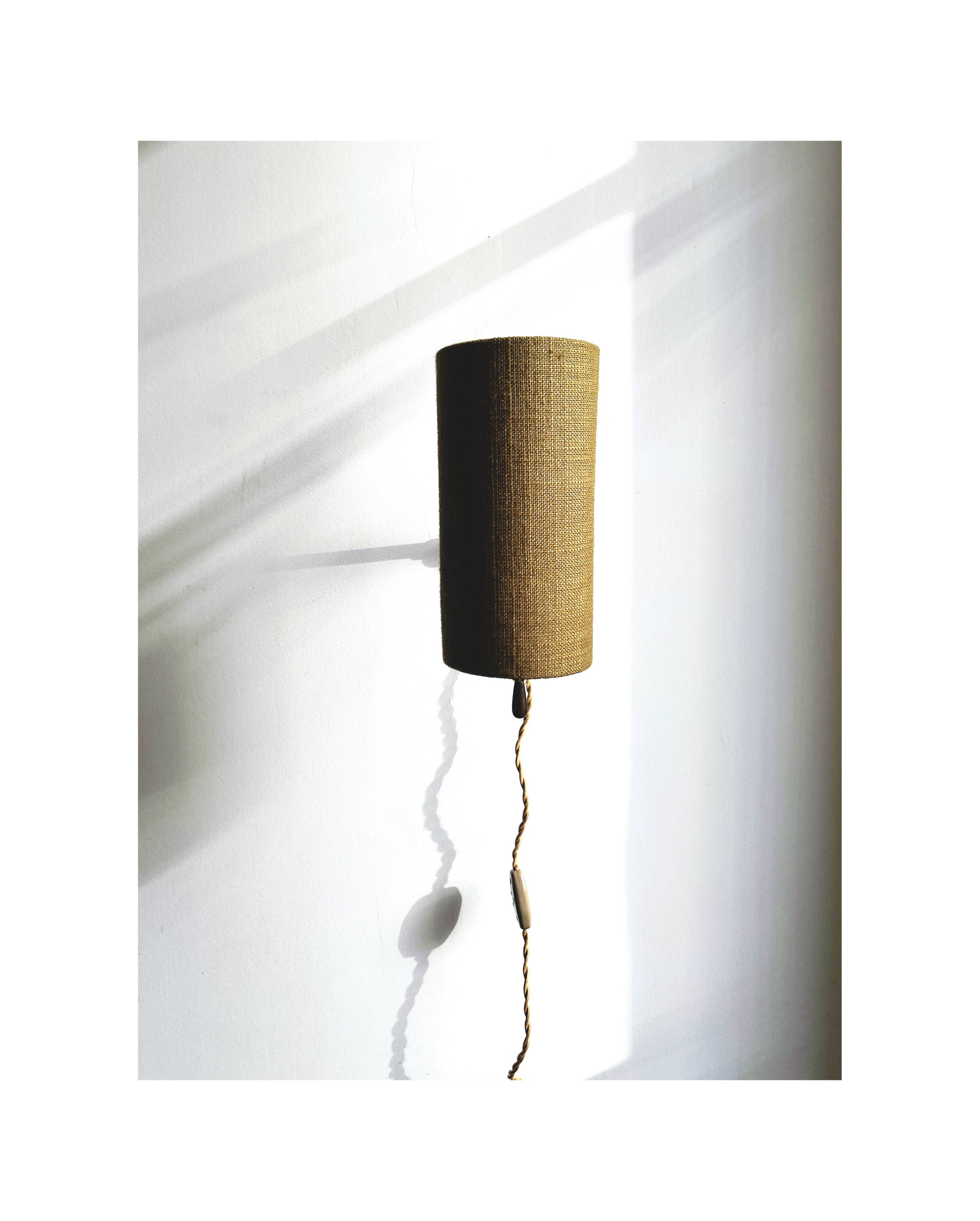 Wall sconce, brass bracket and khaki lampshade, France 1950