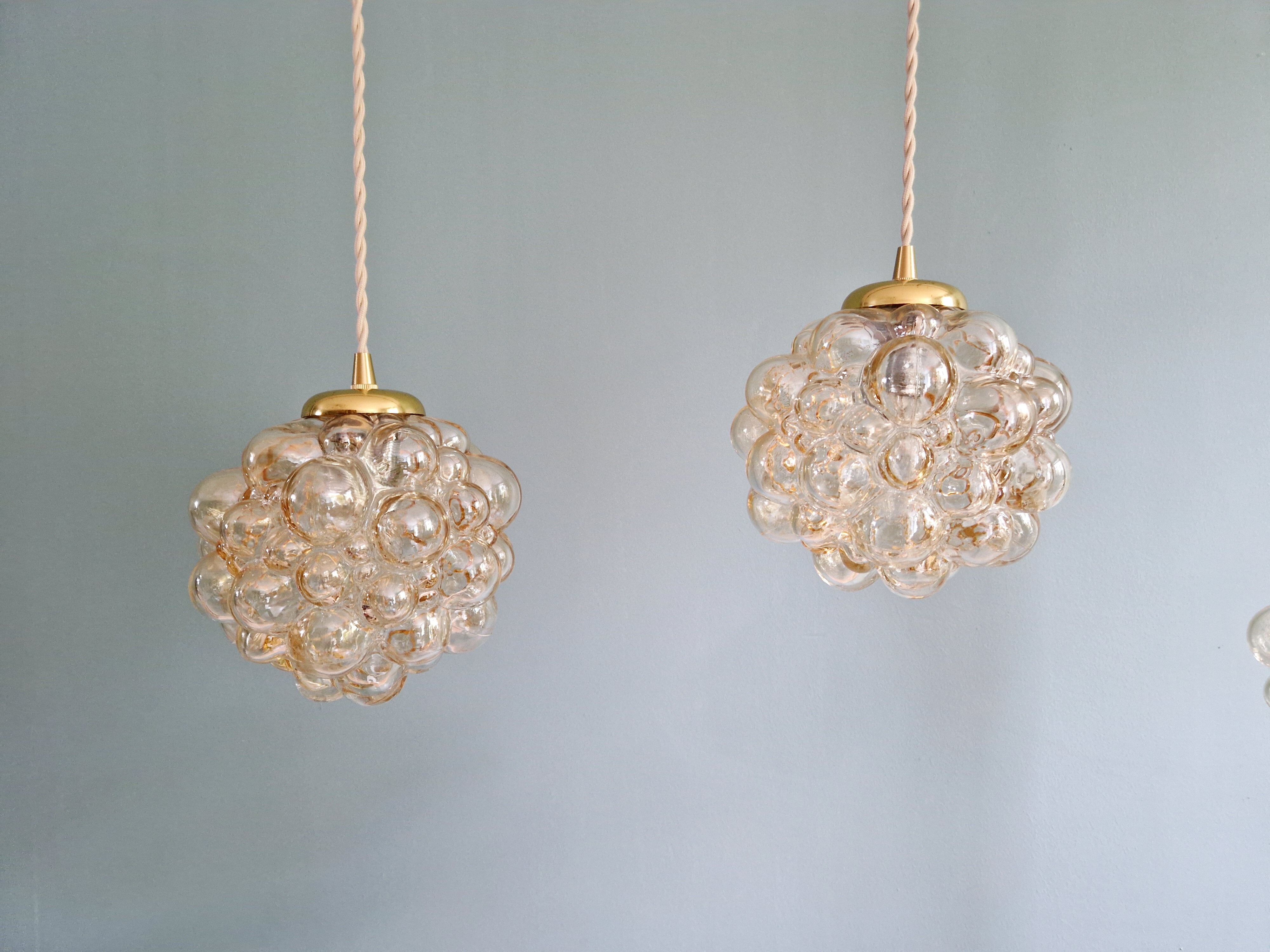 Amber bubble glass pendant (3 available), design by Helena Tynell, 1970.