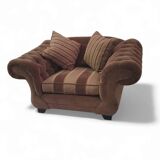 Large weighty love seat with the original matching cushions. Marked "Handmade in Holland"