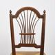 3 wooden and straw chairs, decorated with a sheaf of wheat.