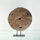 Old decorative wooden wheel on foot