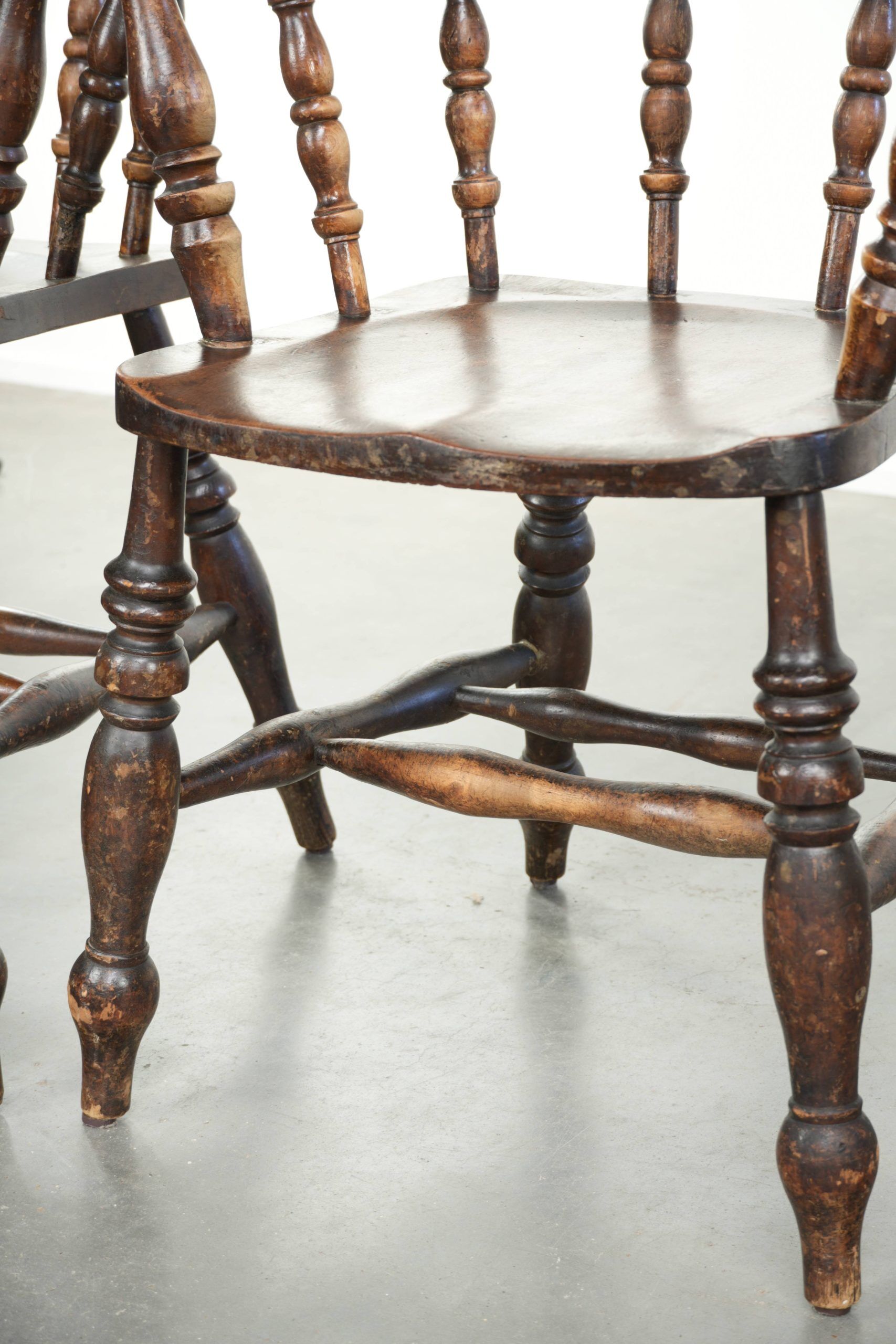 Set of four wooden English antique pub/captain chairs from the 19th century