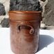 Trio of stoneware pots with lids
