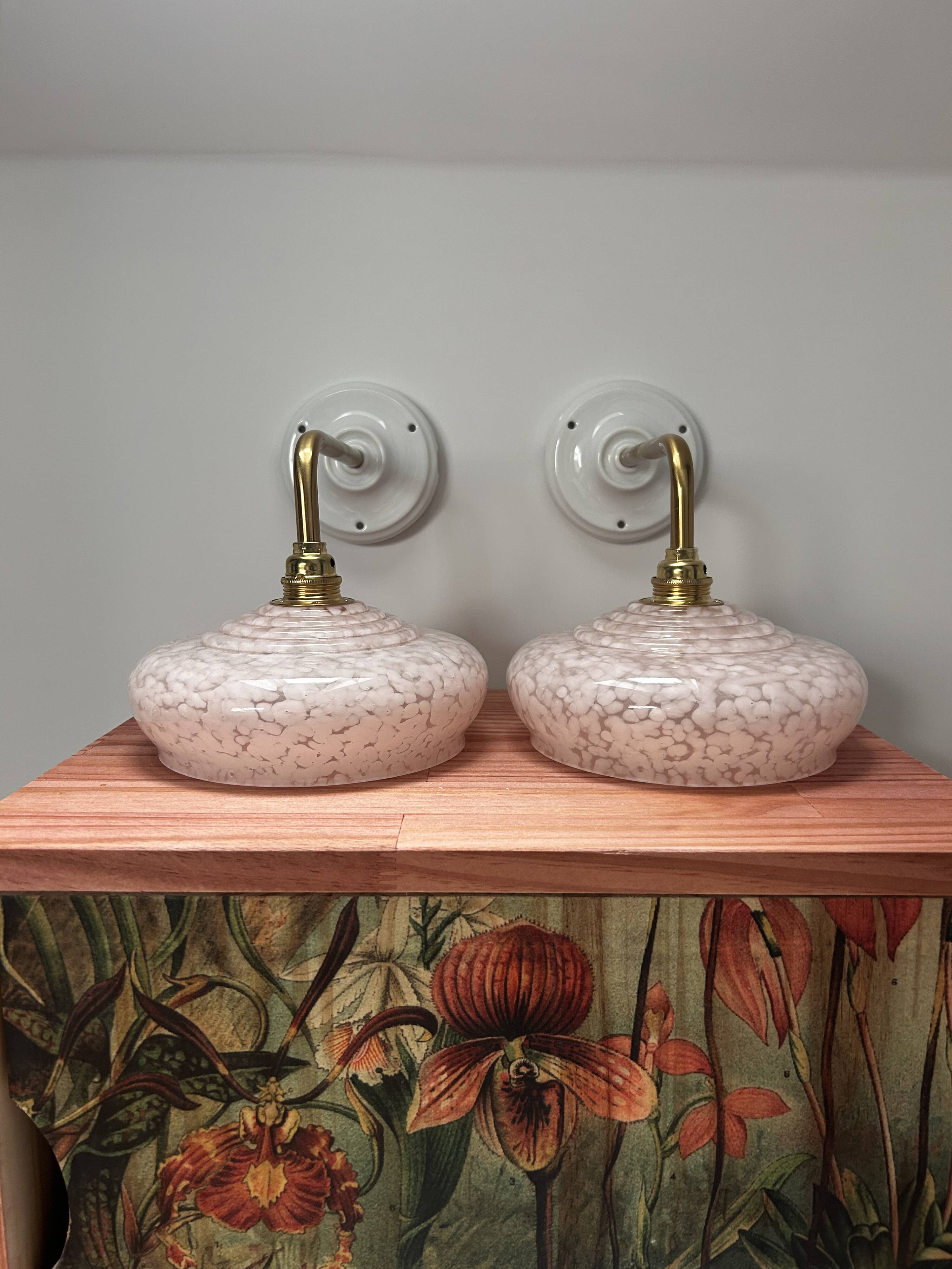 Pair of pink globe wall lights