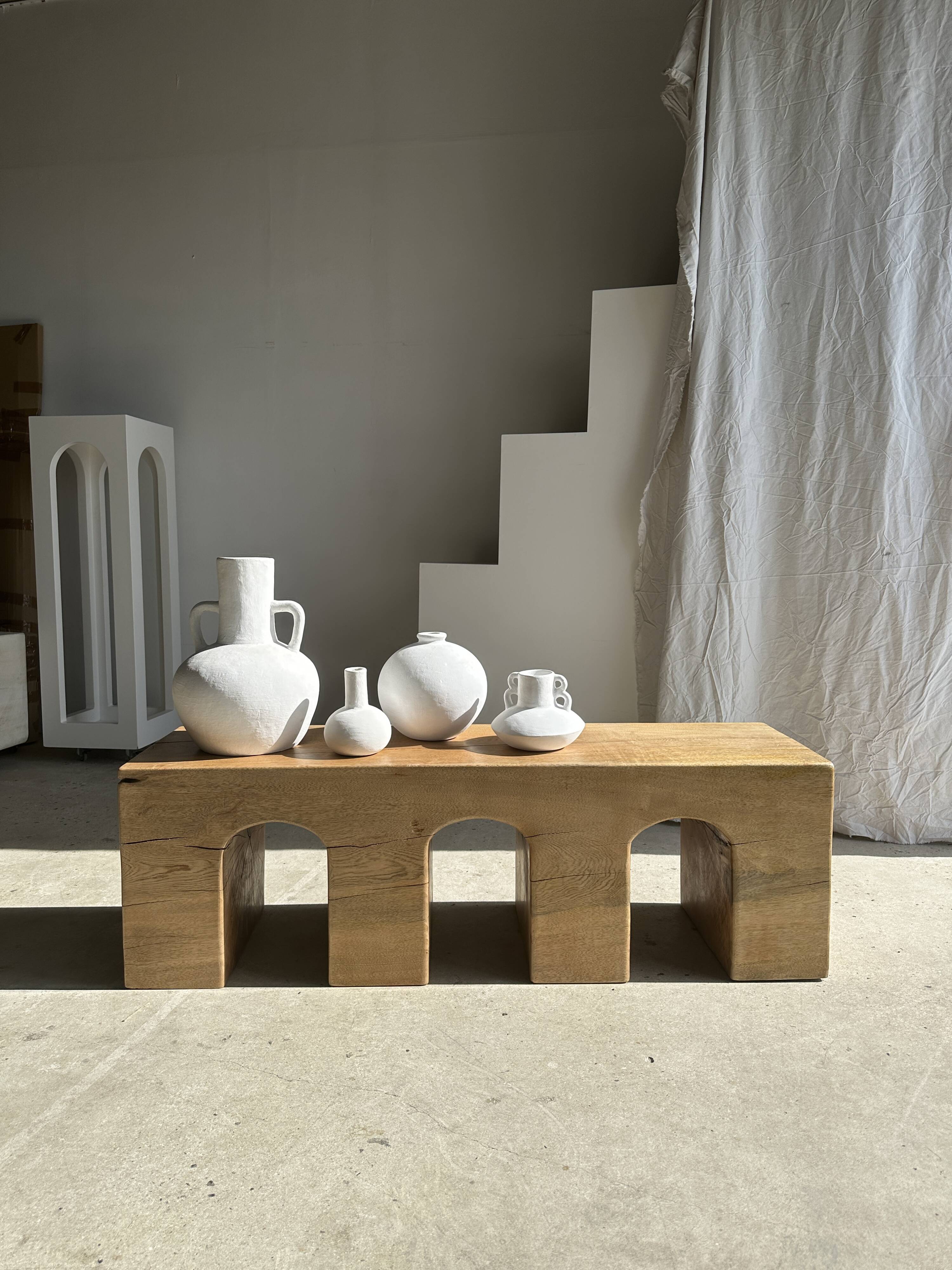 Solid monoxyl wood bench with carved 3-arch base - Natural wood color